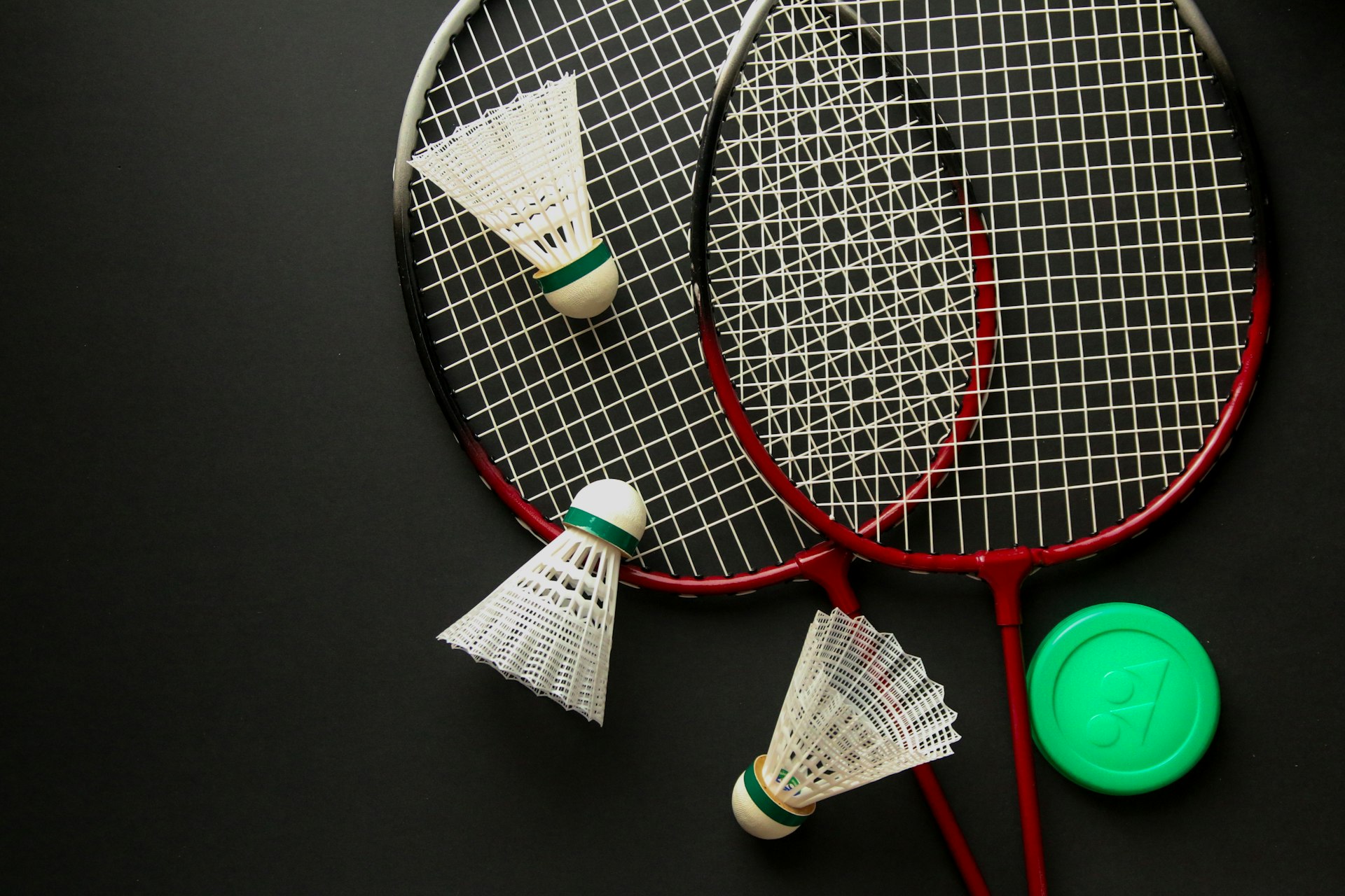 A couple of tennis rackets sitting on top of a table